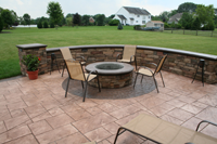 backyard concrete patio and seating wall