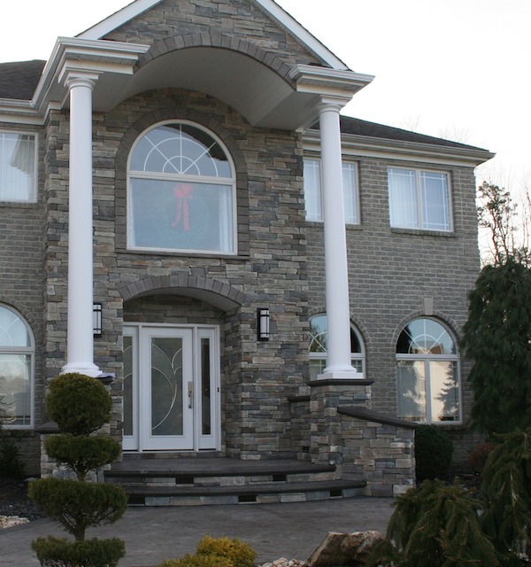 stamped concrete walkway, cultured stone front entrance, custom bullnose steps